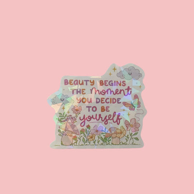 Sticker holographique — Beauty begins the moment you decide to be yourself · À l'unité