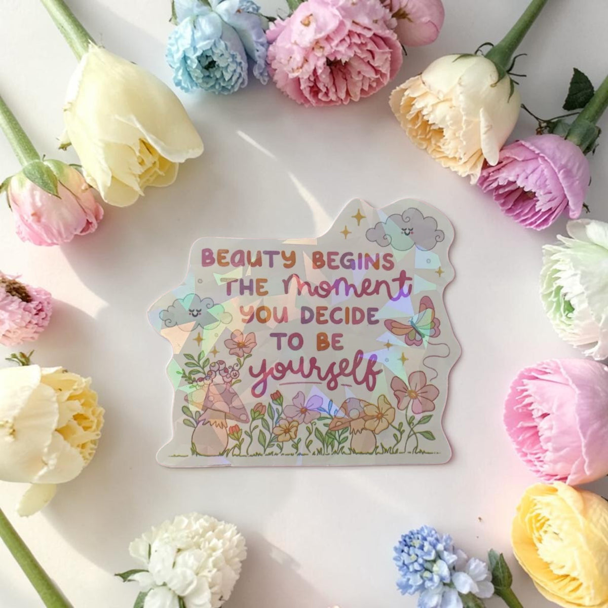 Sticker holographique — Beauty begins the moment you decide to be yourself · À l'unité